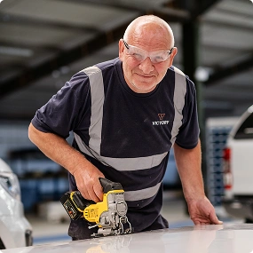 Victory Conversions engineering team working on vehicle conversions