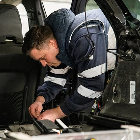 Vehicle conversion specialists working in workshop