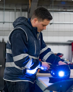 worker building a car